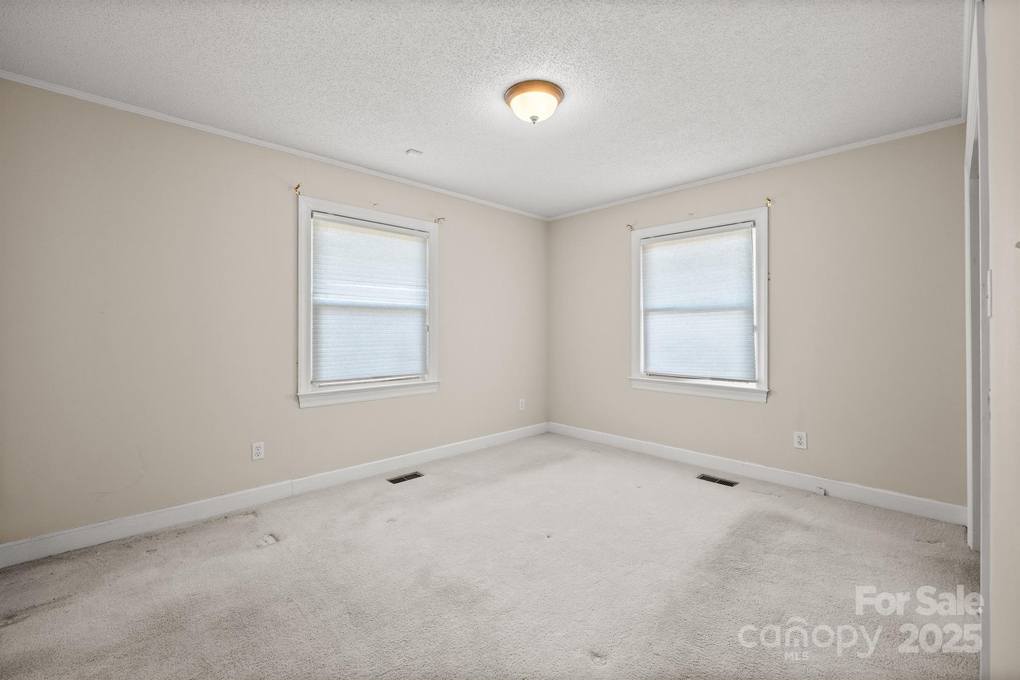 484 Stutts Road Mooresville, NC 28117 - Photo 25 of 28 an empty room with windows