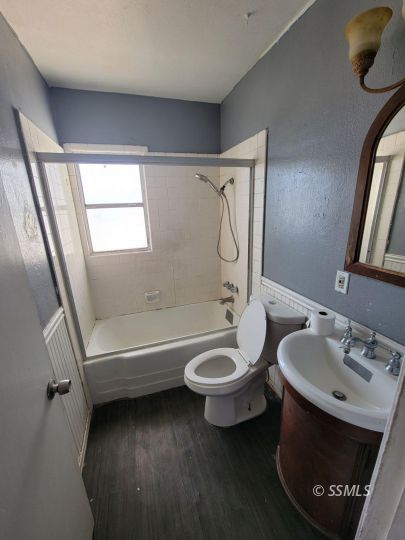 513 North Gold Canyon Street Ridgecrest, CA 93555 - Photo 5 of 10 a bathroom with a sink toilet and shower