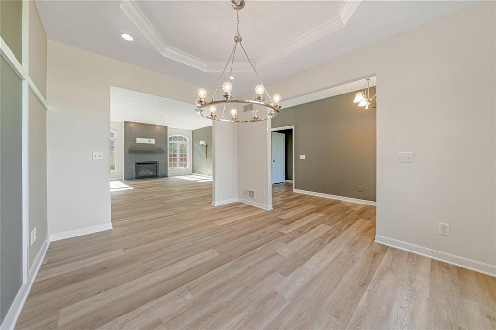 116 Brush Run Road Greensburg, PA 15601 - Photo 6 of 20 a view of a livingroom with a chandelier fan and wooden floor