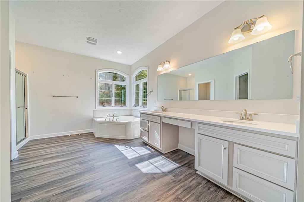 116 Brush Run Road Greensburg, PA 15601 - Photo 8 of 20 a spacious bathroom with a double vanity sink a mirror and a bathtub