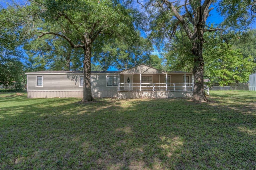 7168 Golden Meadows Road Greenwood, LA 71033 - Photo 1 of 1 Back of house featuring covered porch