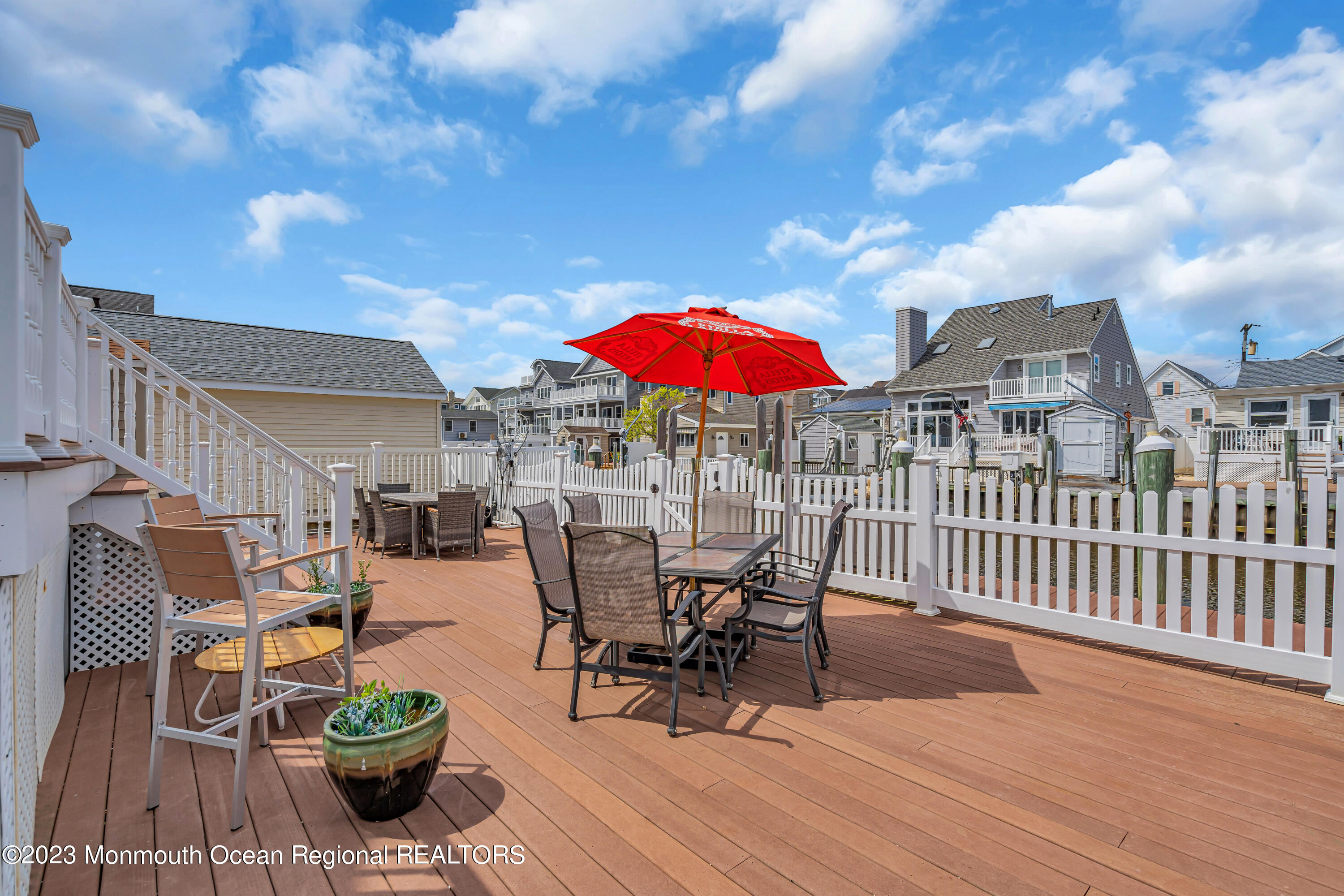 492 Brielle Road Manasquan, NJ 08736 - Photo 9 of 44 a view of a patio with furniture and a table