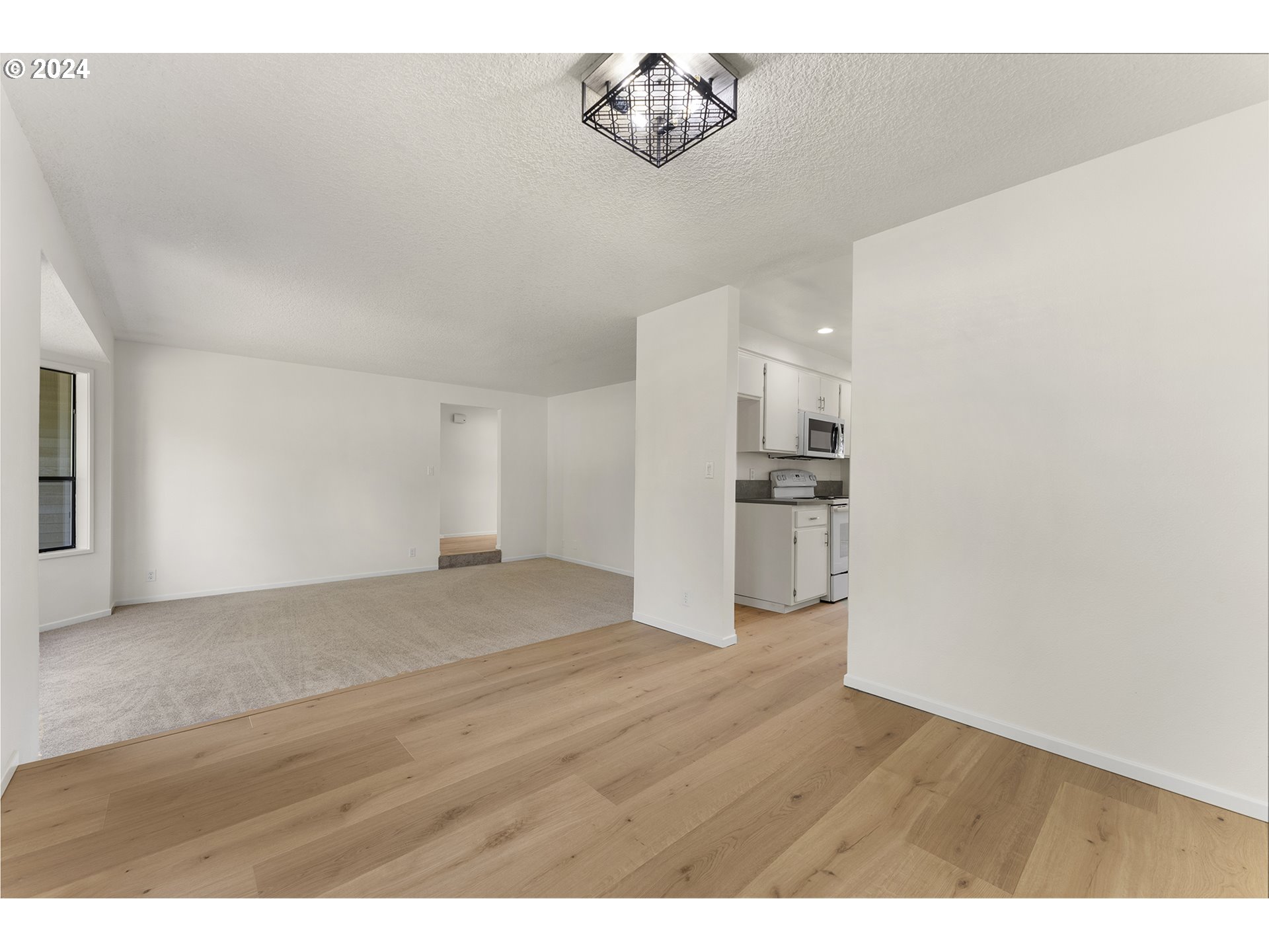 8860 Southwest Maverick Terrace Beaverton, OR 97008 - Photo 12 of 20 a view of empty room with wooden floor