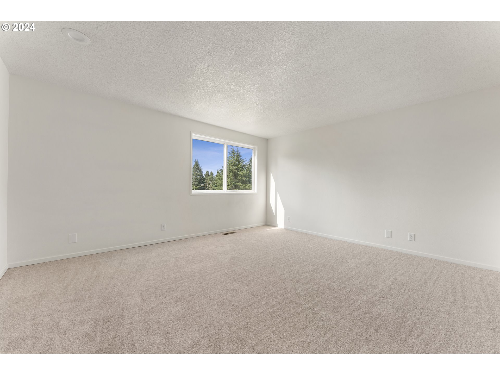 8860 Southwest Maverick Terrace Beaverton, OR 97008 - Photo 13 of 20 a view of an empty room with a window