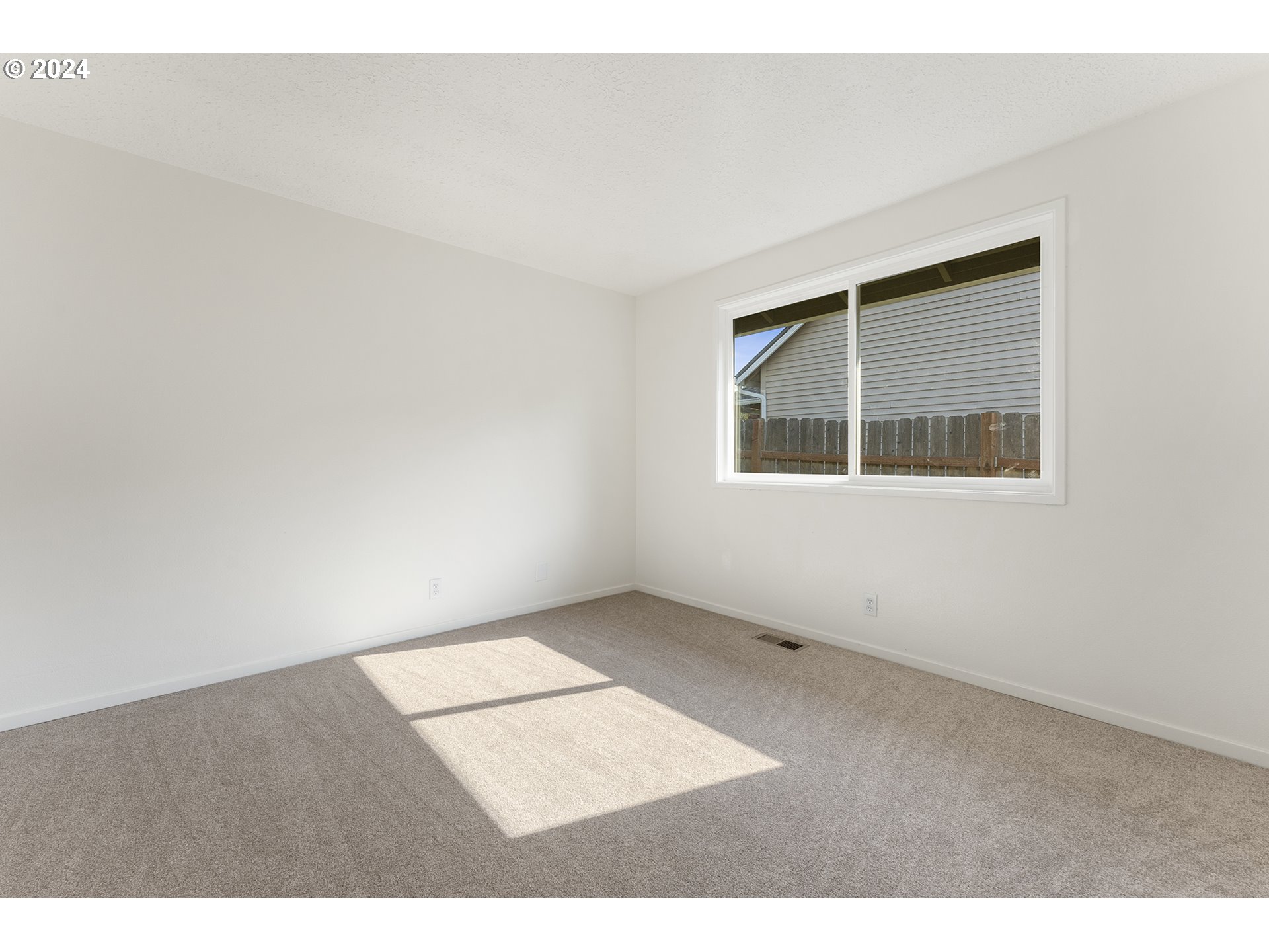 8860 Southwest Maverick Terrace Beaverton, OR 97008 - Photo 16 of 20 an empty room with windows