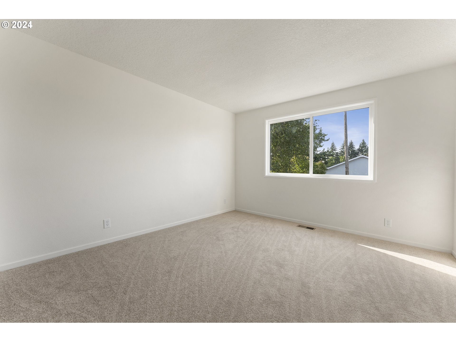8860 Southwest Maverick Terrace Beaverton, OR 97008 - Photo 18 of 20 a view of an empty room with a window