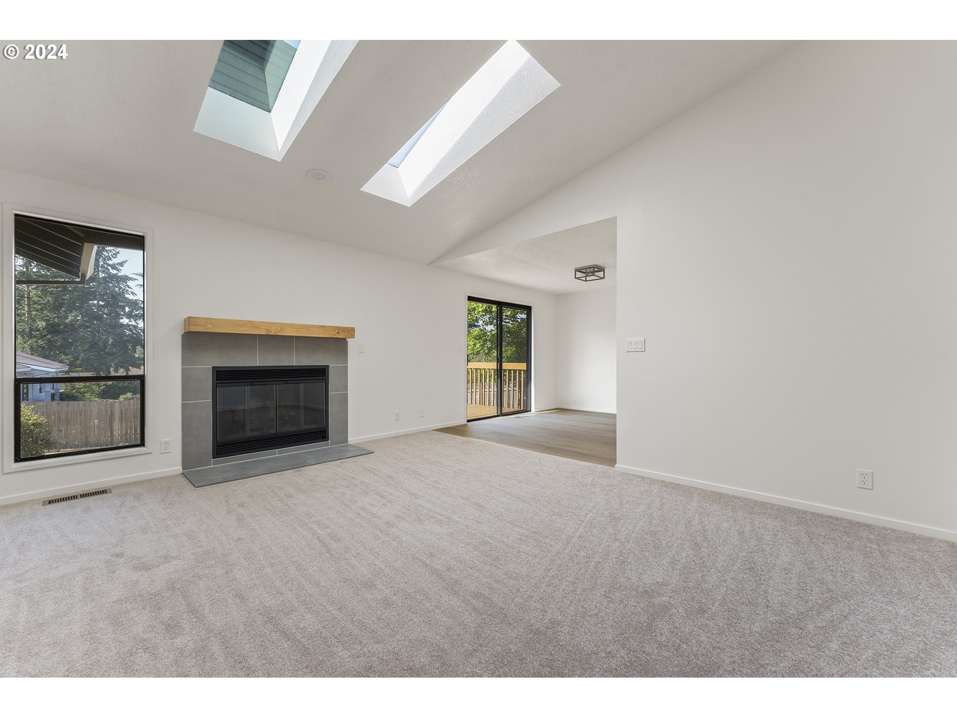 8860 Southwest Maverick Terrace Beaverton, OR 97008 - Photo 3 of 20 a view of empty room with a fireplace