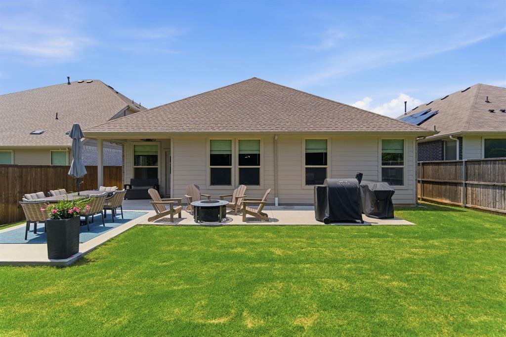 5621 Round Hl Road Denton, TX 76210 - Photo 24 of 27 a front view of house with yard and outdoor seating
