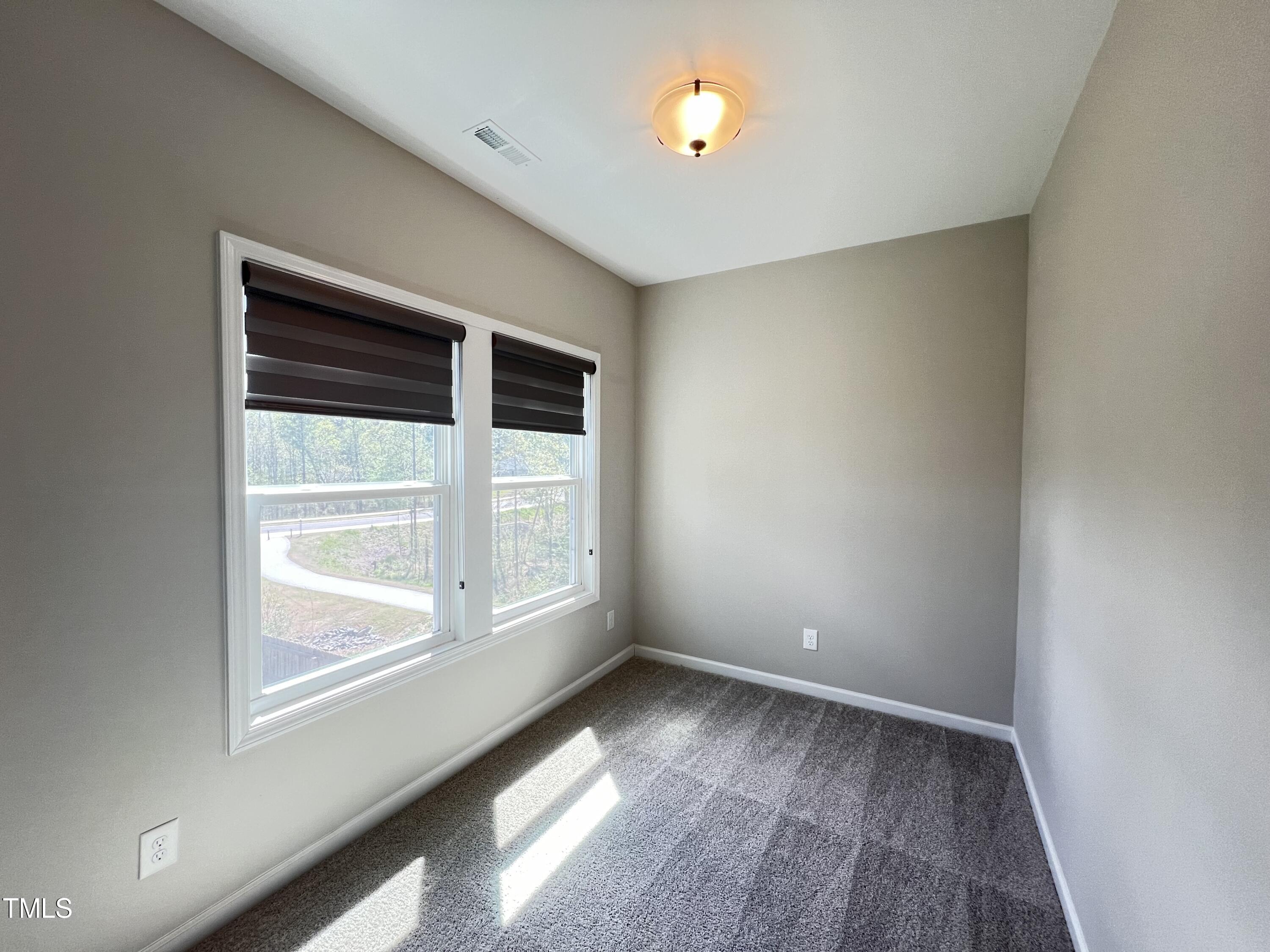 3385 Lovage Drive Apex, NC 27502 - Photo 11 of 19 an empty room with a window