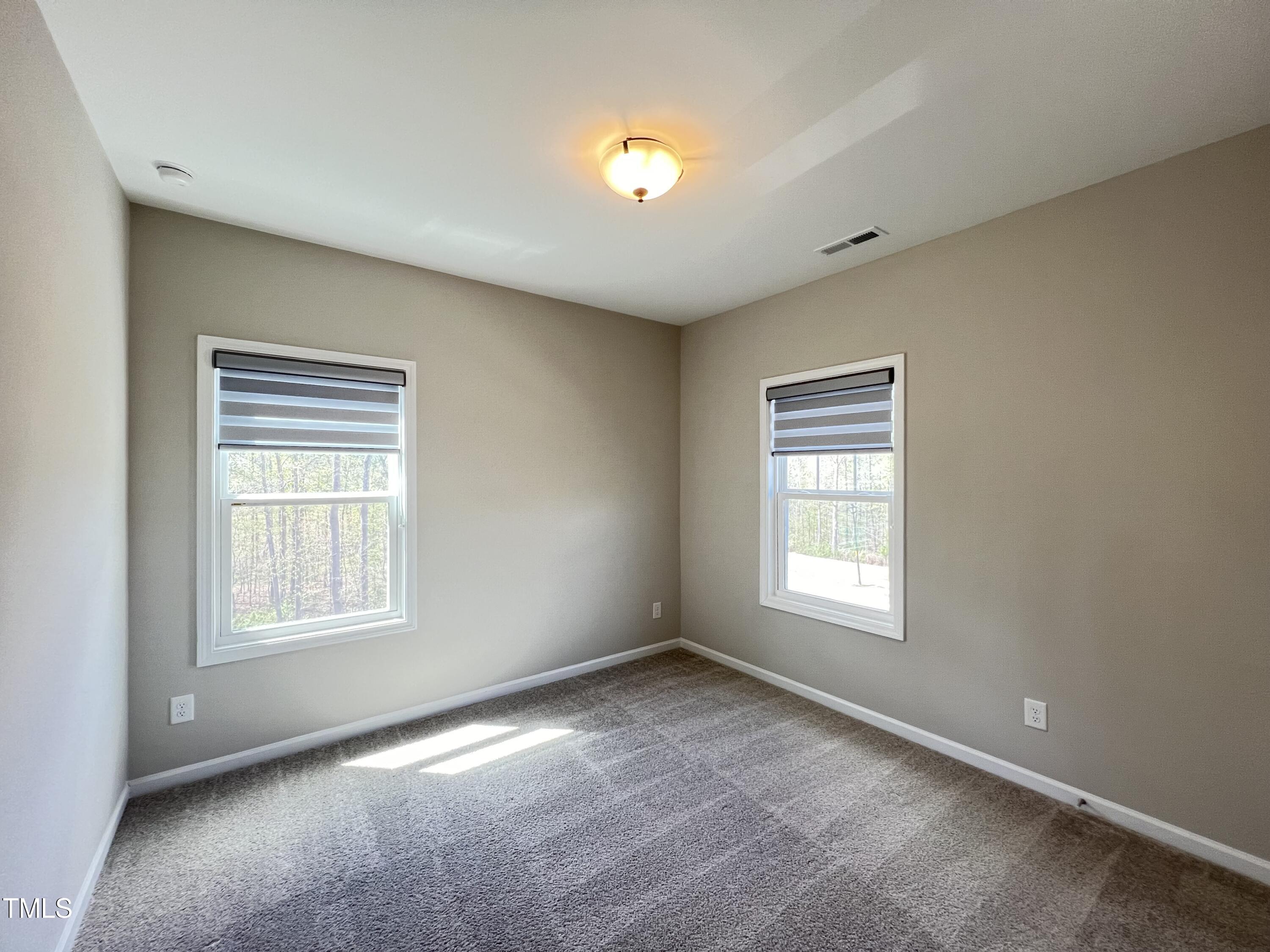 3385 Lovage Drive Apex, NC 27502 - Photo 15 of 19 a view of an empty room with a window