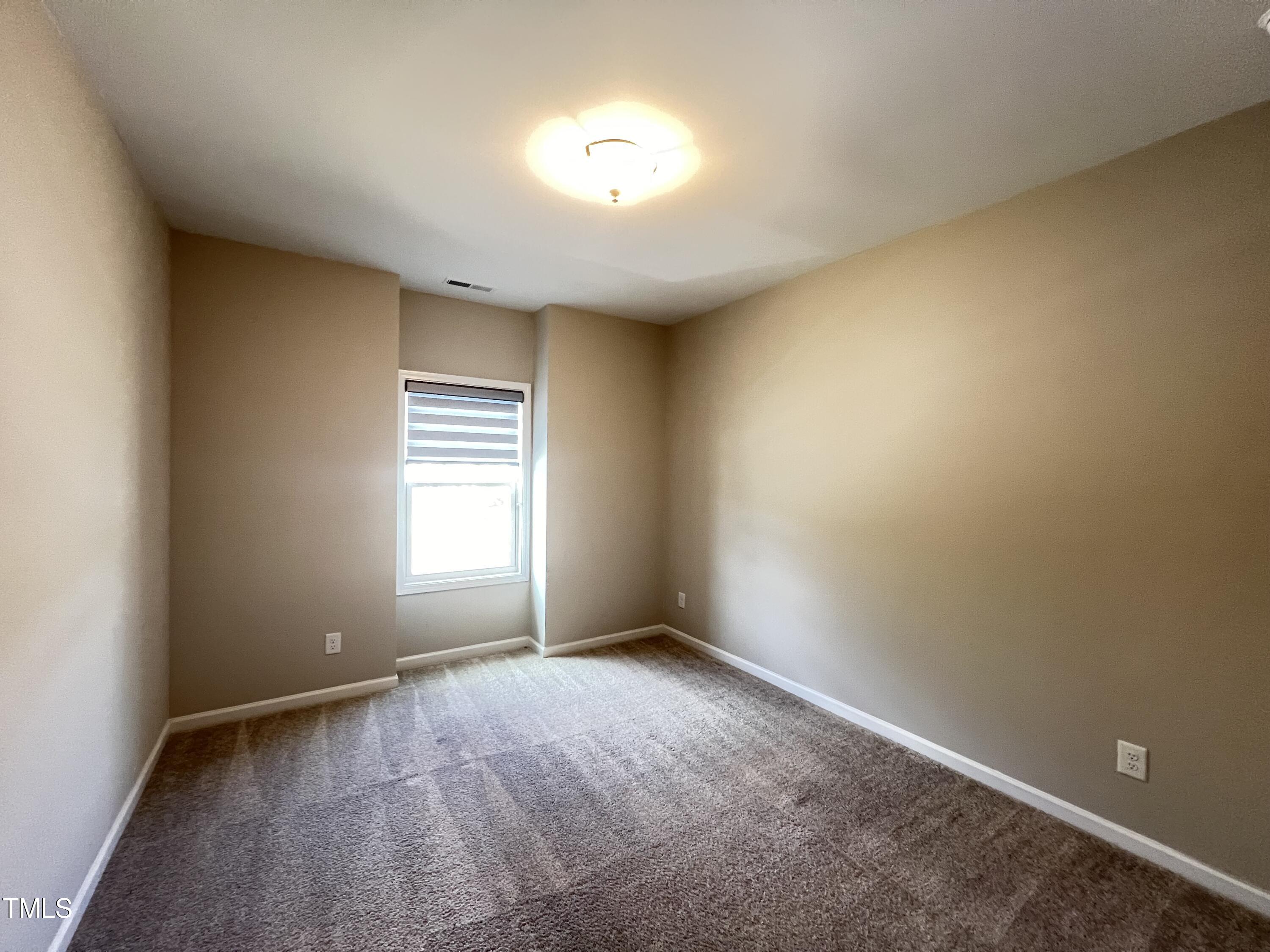 3385 Lovage Drive Apex, NC 27502 - Photo 16 of 19 a view of empty room with window