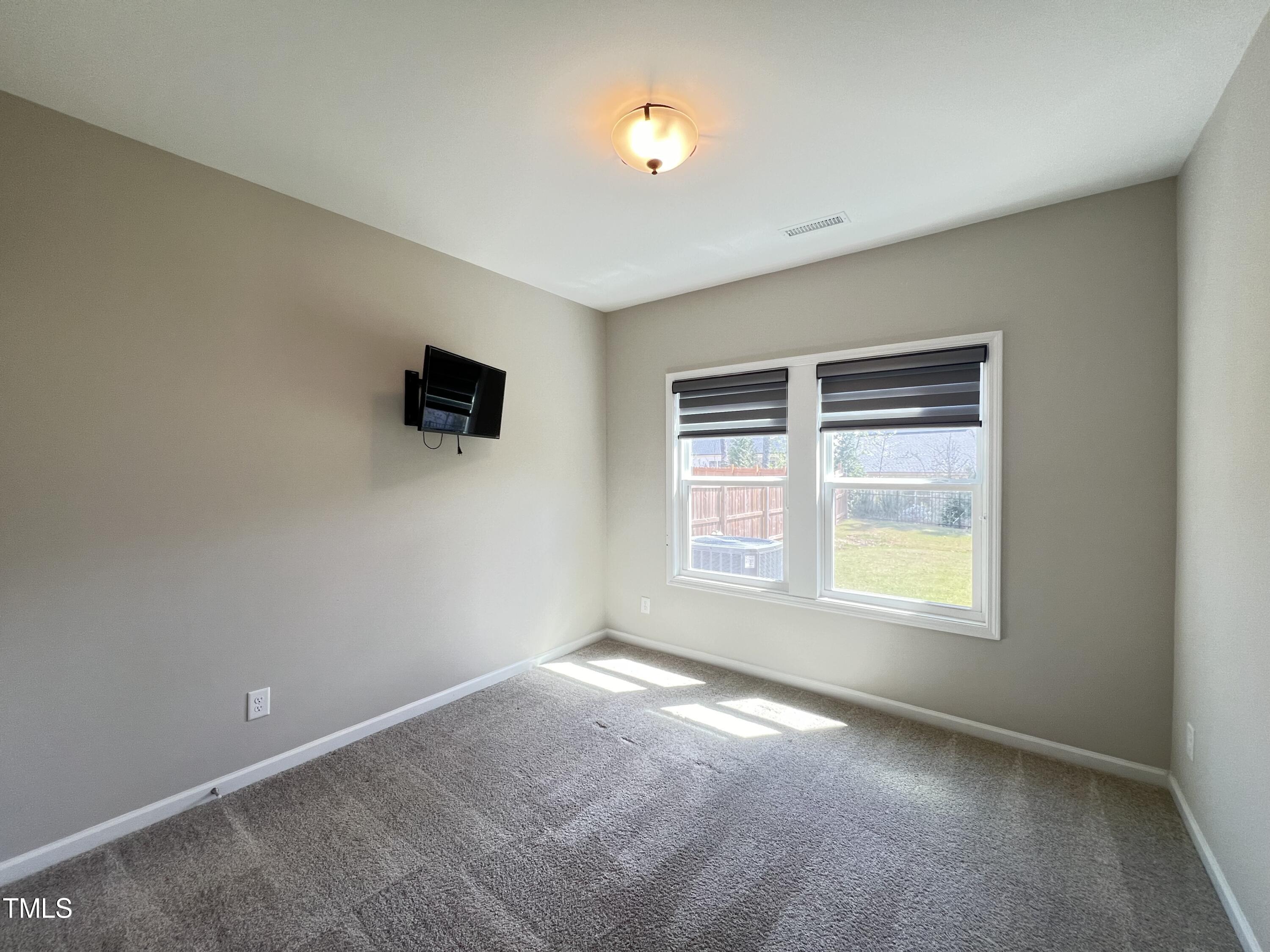 3385 Lovage Drive Apex, NC 27502 - Photo 6 of 19 a view of an empty room with a window