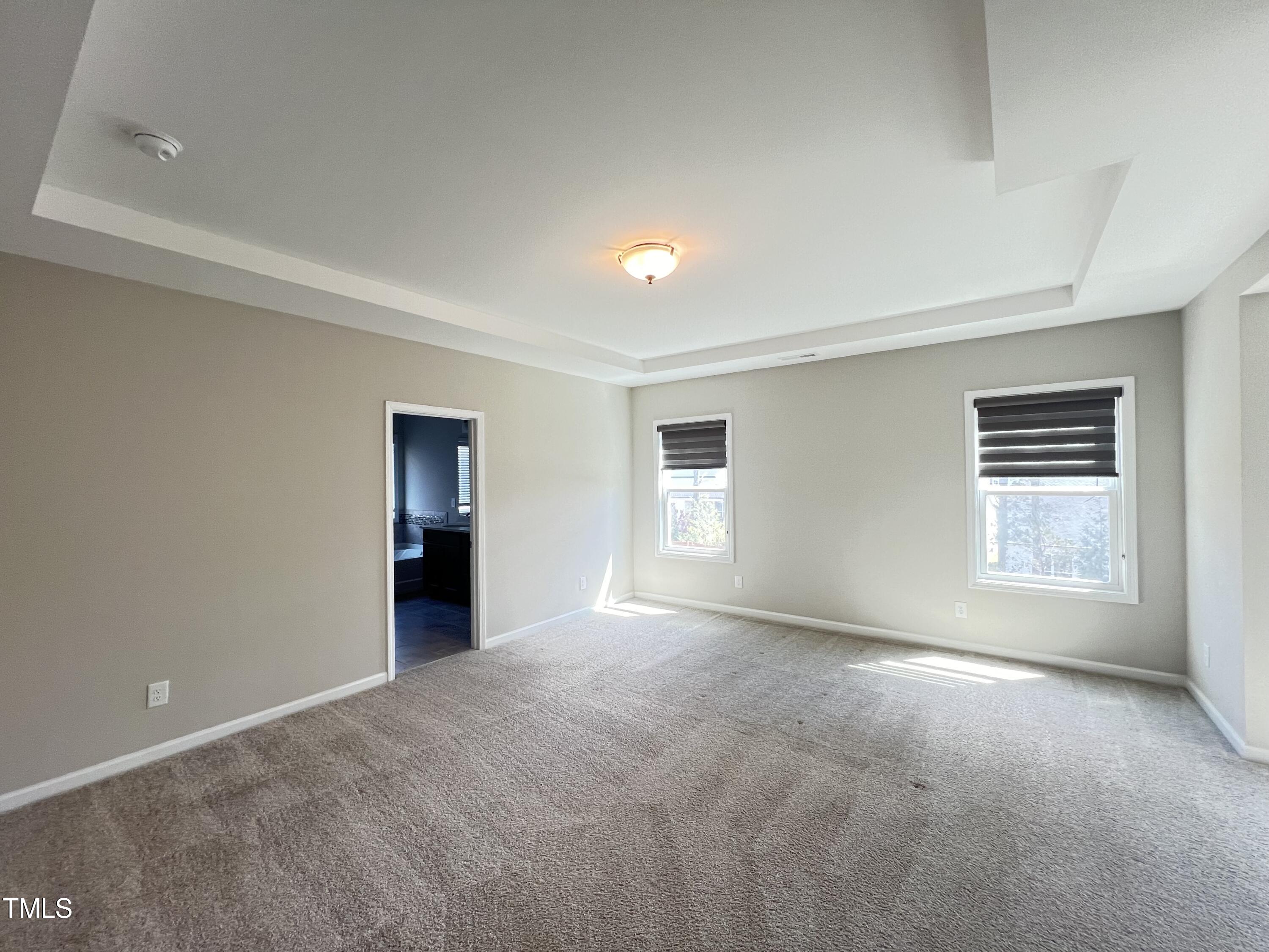 3385 Lovage Drive Apex, NC 27502 - Photo 7 of 19 a view of an empty room with a window