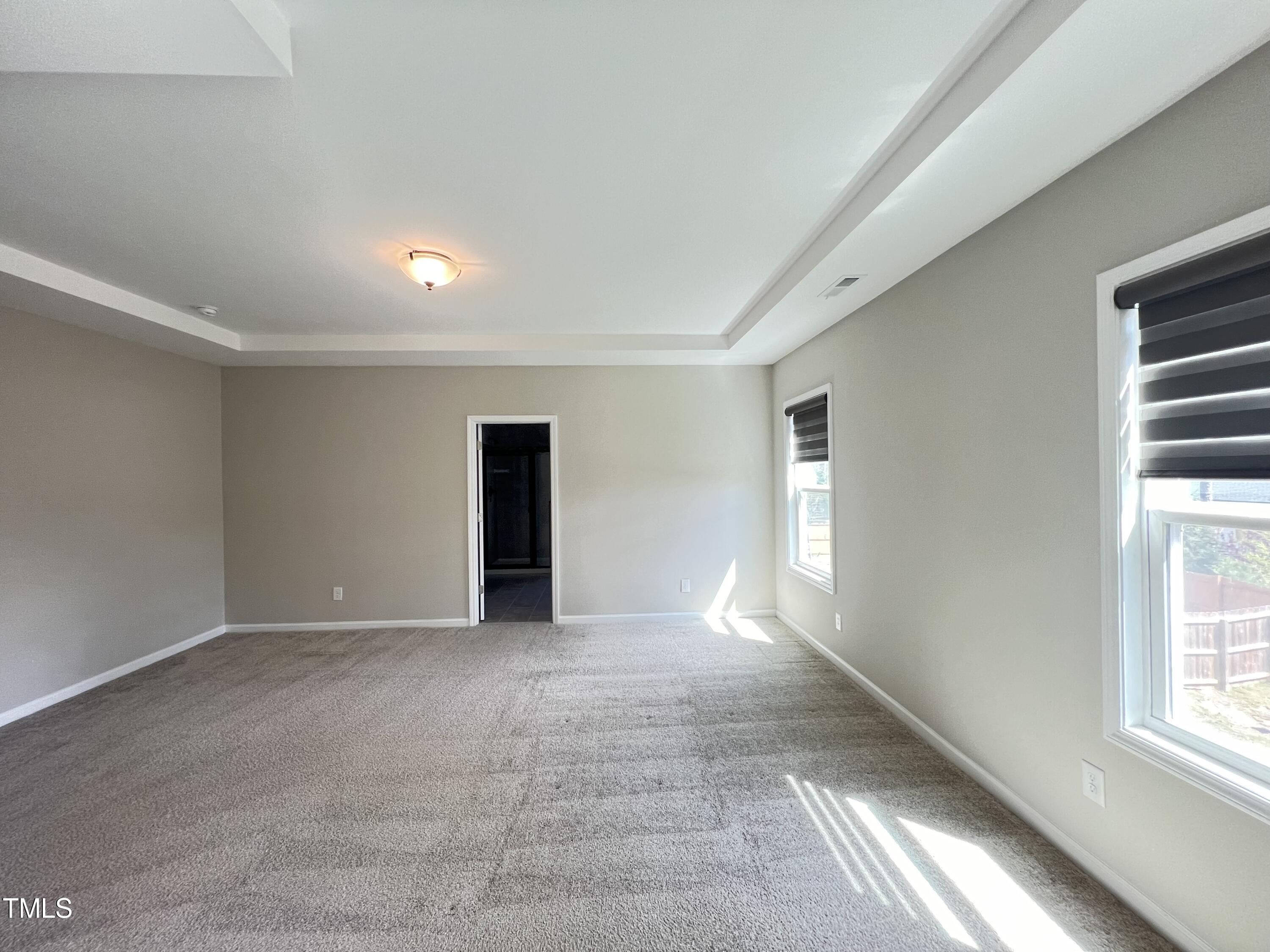 3385 Lovage Drive Apex, NC 27502 - Photo 9 of 19 a view of empty room with windows