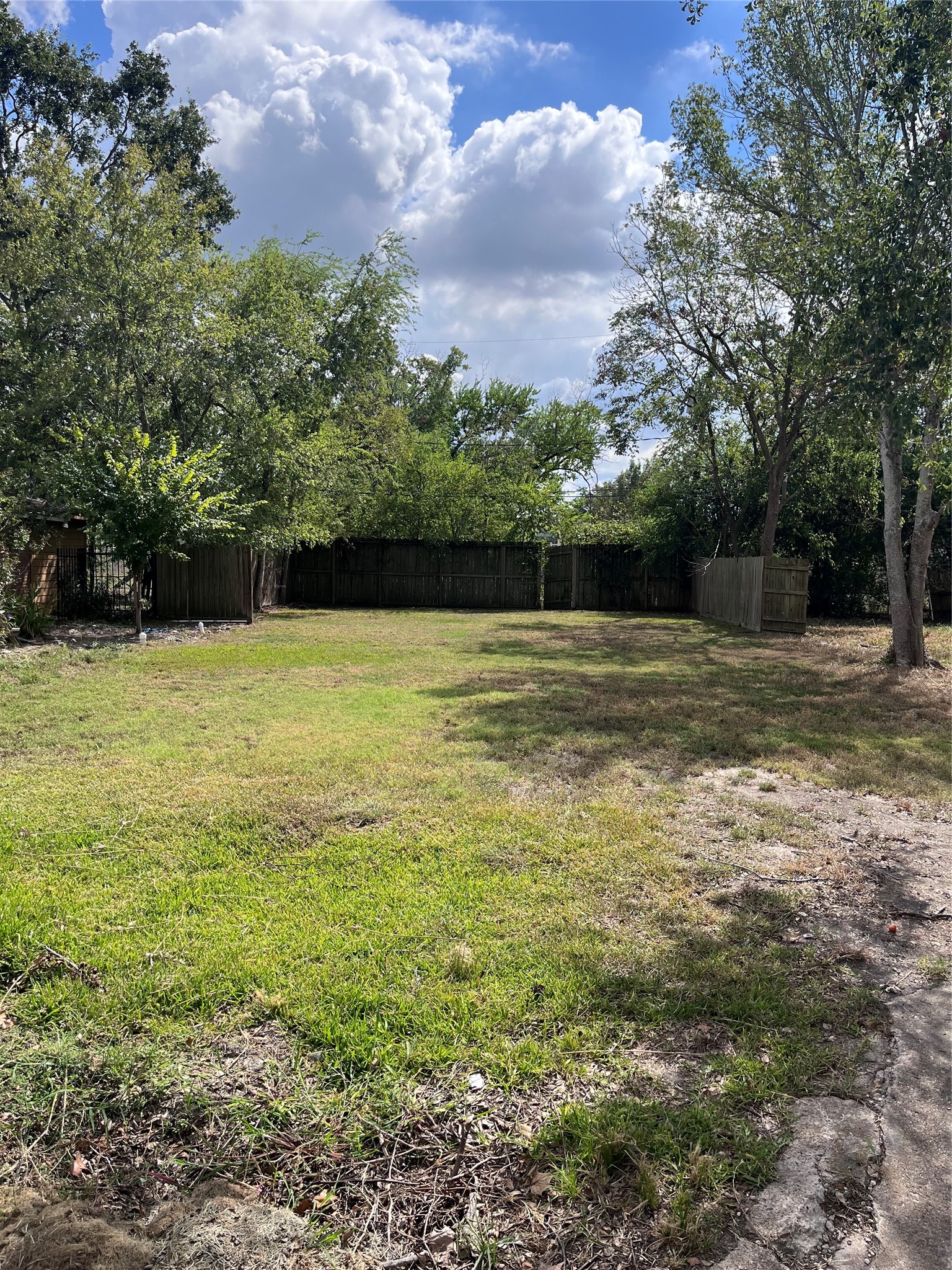 4305 Lafayette Street Bellaire, TX 77401 - Photo 1 of 13 a swimming pool with an outdoor space and seating area