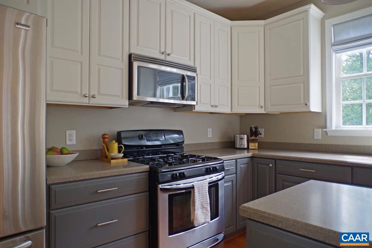 2059 Ridgetop Drive Charlottesville, VA 22903 - Photo 16 of 68 a kitchen with granite countertop a stove sink and cabinets