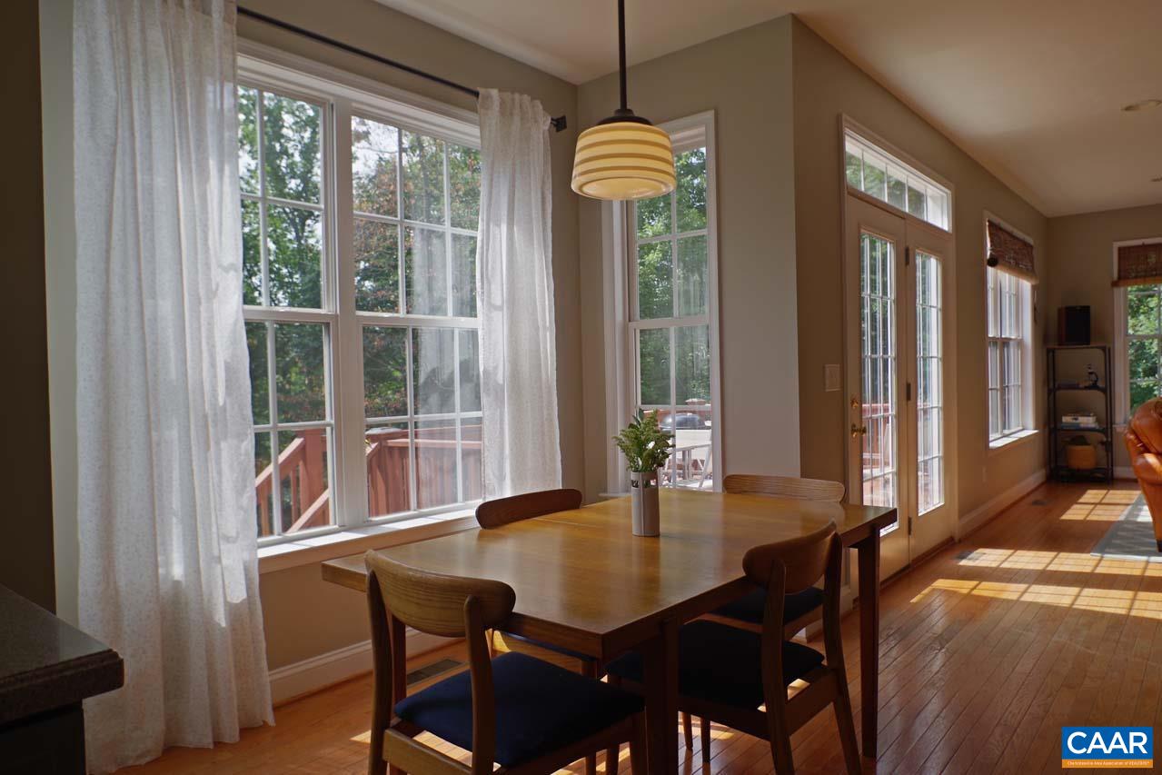 2059 Ridgetop Drive Charlottesville, VA 22903 - Photo 18 of 68 a view of a dining room with furniture window and outside view