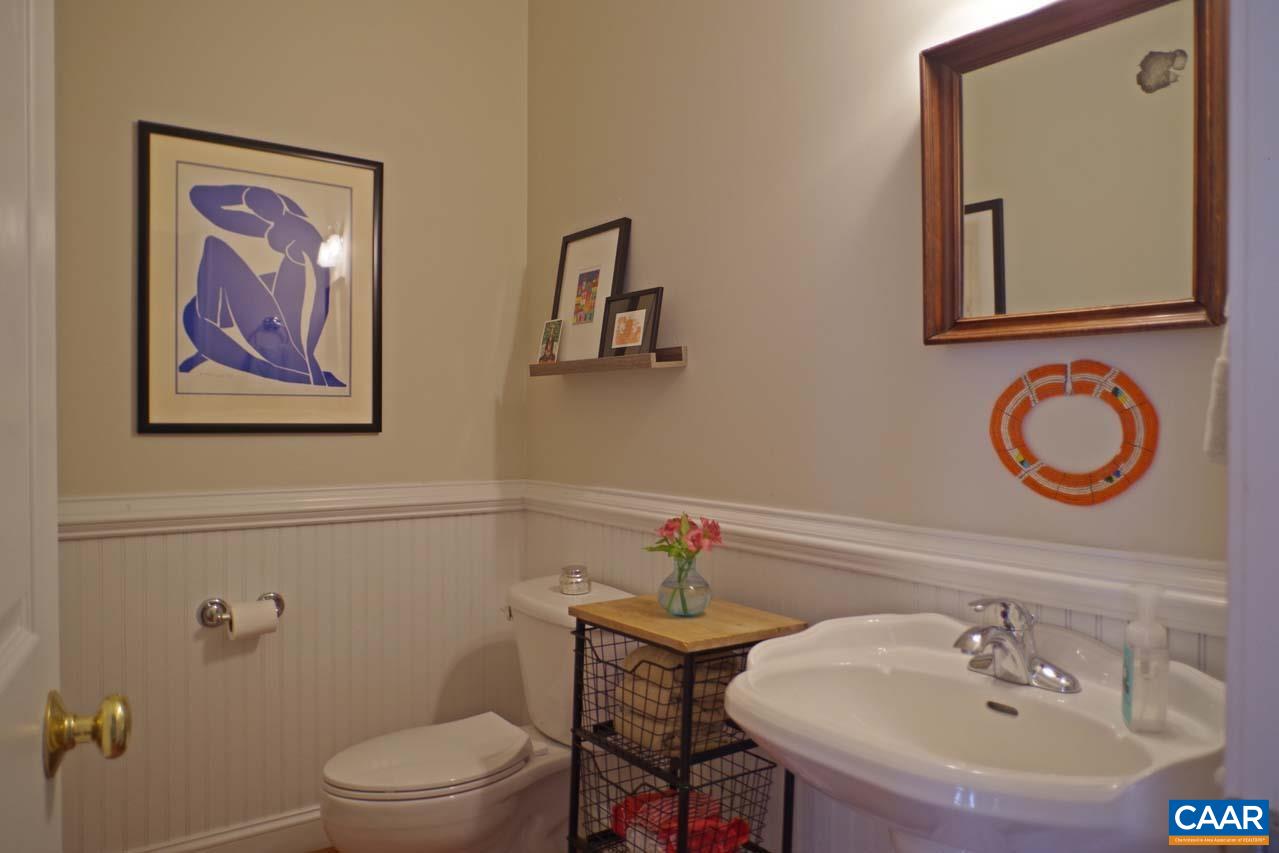 2059 Ridgetop Drive Charlottesville, VA 22903 - Photo 28 of 68 a bathroom with a toilet a sink and mirror