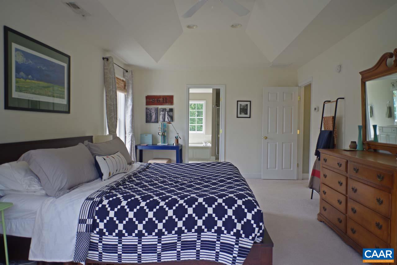 2059 Ridgetop Drive Charlottesville, VA 22903 - Photo 32 of 68 a bedroom with a large bed and a dresser