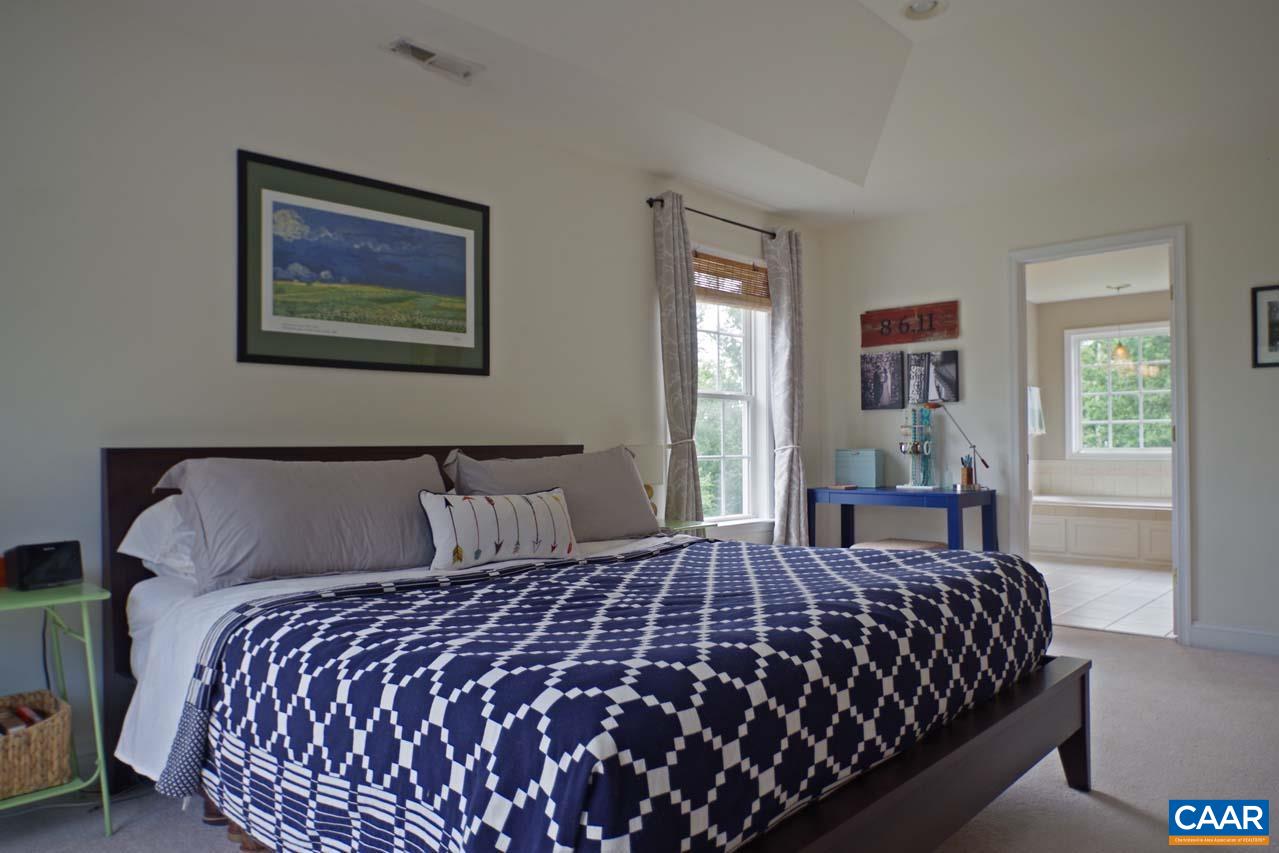 2059 Ridgetop Drive Charlottesville, VA 22903 - Photo 34 of 68 a bedroom with a large bed and a window
