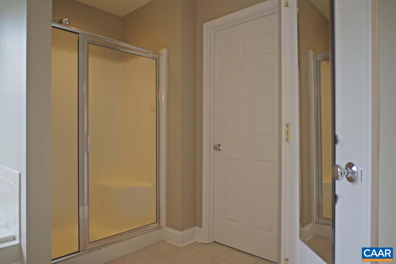 2059 Ridgetop Drive Charlottesville, VA 22903 - Photo 37 of 68 a bathroom with a shower and a door
