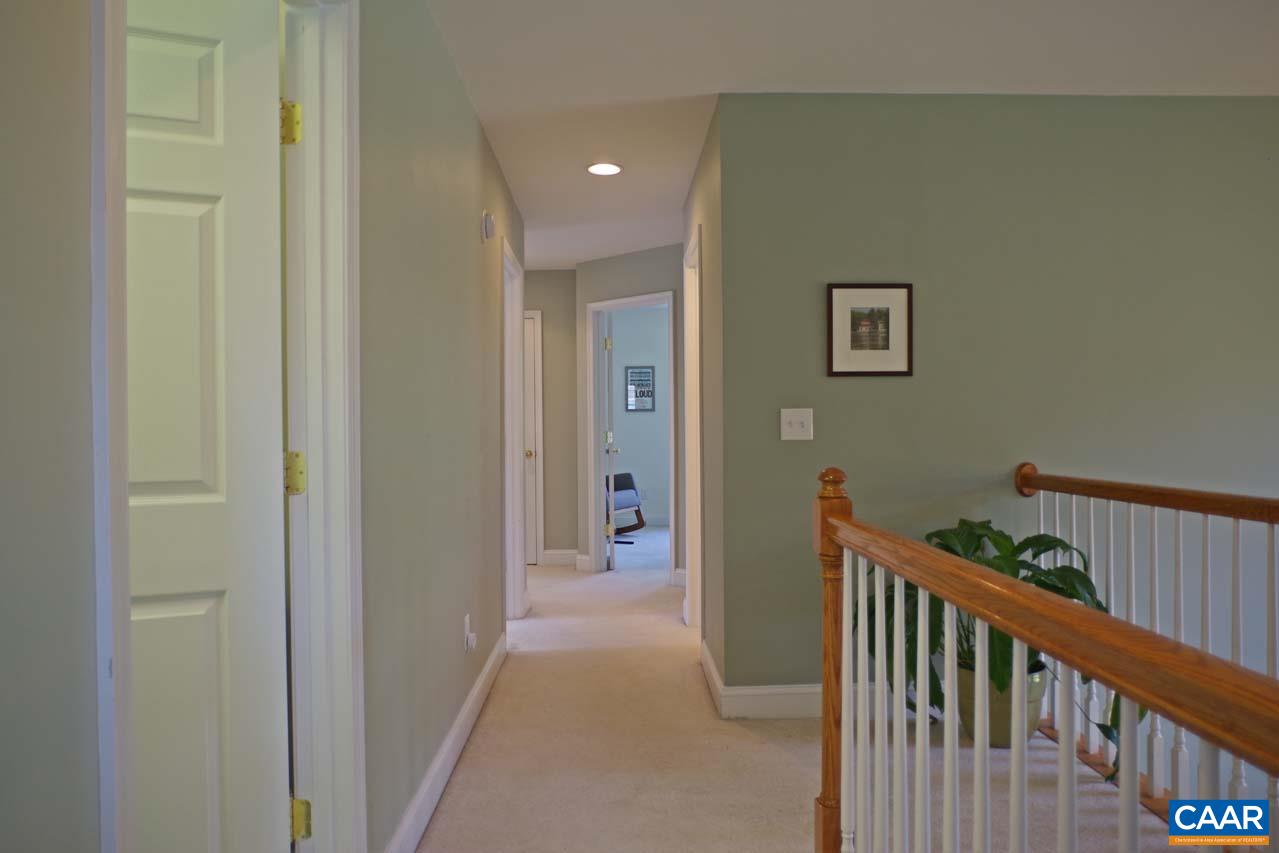 2059 Ridgetop Drive Charlottesville, VA 22903 - Photo 38 of 68 a view of a hallway with wooden floor and windows
