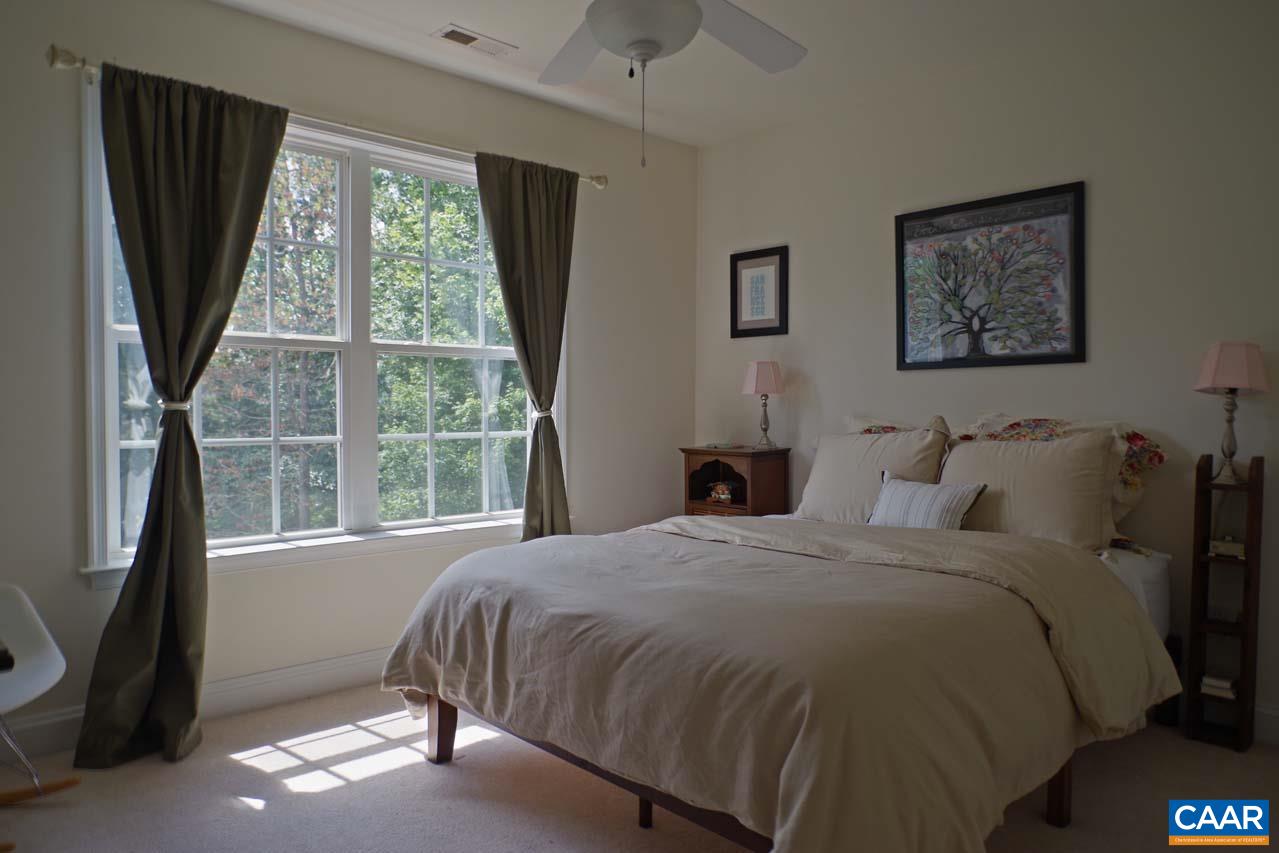2059 Ridgetop Drive Charlottesville, VA 22903 - Photo 42 of 68 a bedroom with a bed and a large window