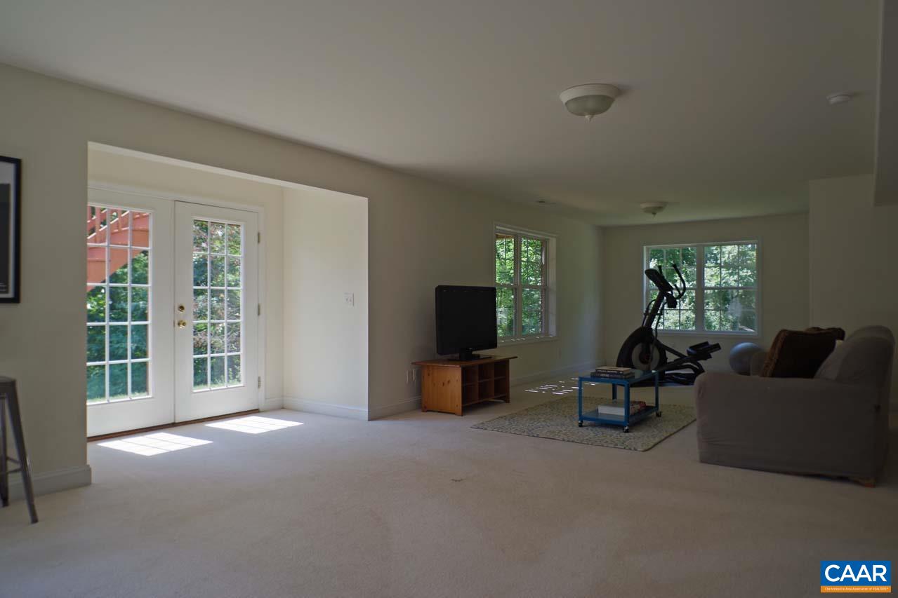 2059 Ridgetop Drive Charlottesville, VA 22903 - Photo 52 of 68 a living room with furniture and a flat screen tv