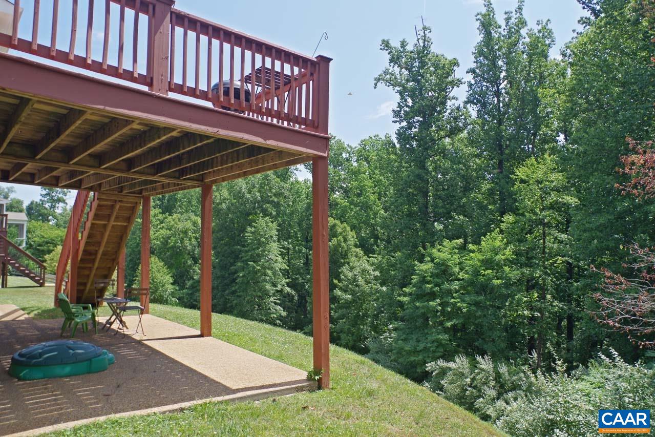 2059 Ridgetop Drive Charlottesville, VA 22903 - Photo 63 of 68 a view of a patio with table and chairs with wooden floor and fence