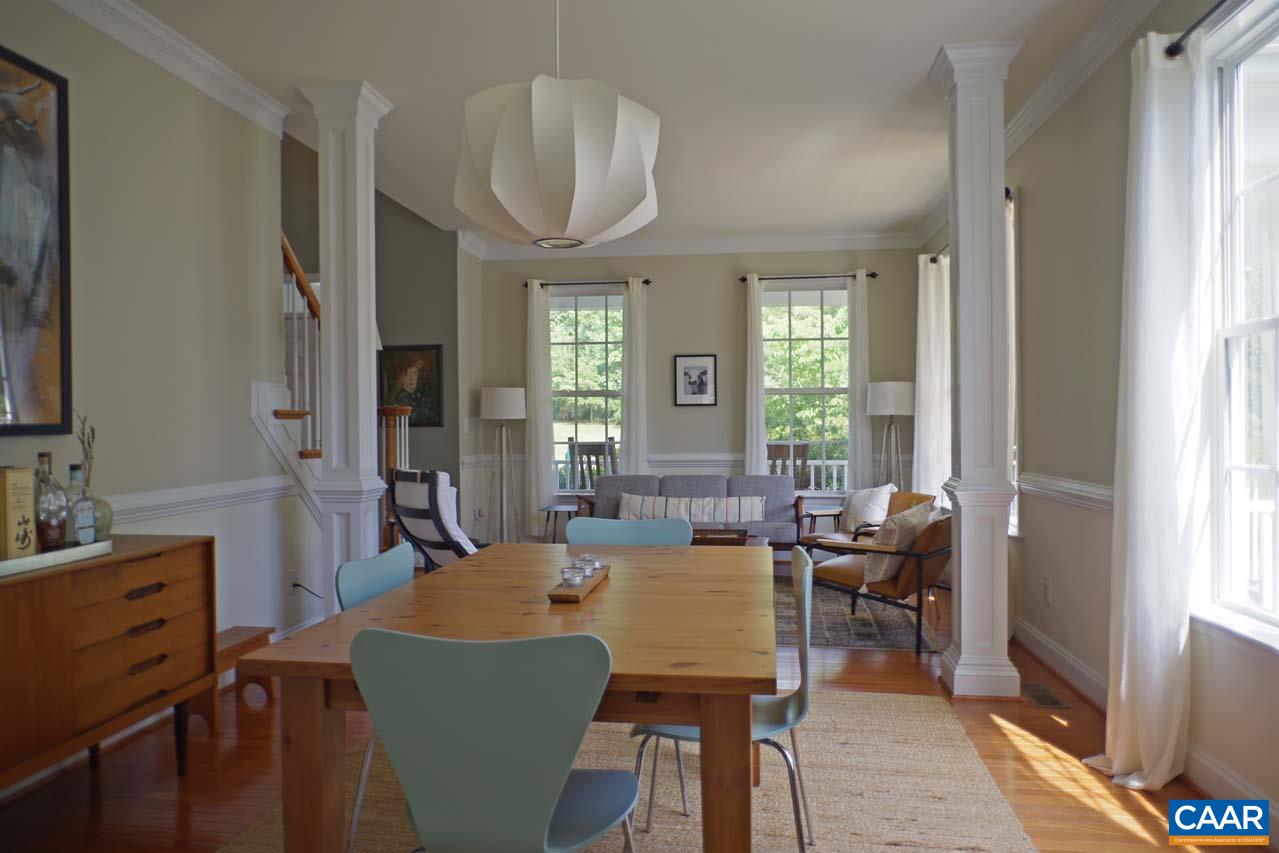 2059 Ridgetop Drive Charlottesville, VA 22903 - Photo 10 of 68 a view of a dining room with furniture window and wooden floor