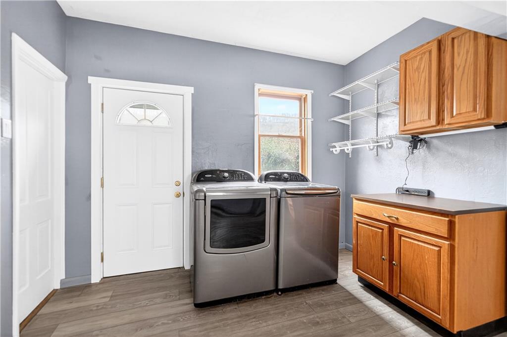 101 7th Street Monongahela, PA 15063 - Photo 13 of 43 a utility room with stainless steel appliances granite countertop a stove a sink and a refrigerator with wooden floors