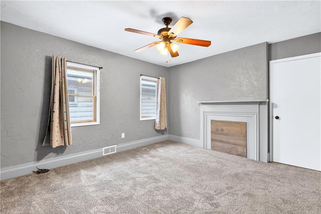 101 7th Street Monongahela, PA 15063 - Photo 20 of 43 an empty room with windows and ceiling fan