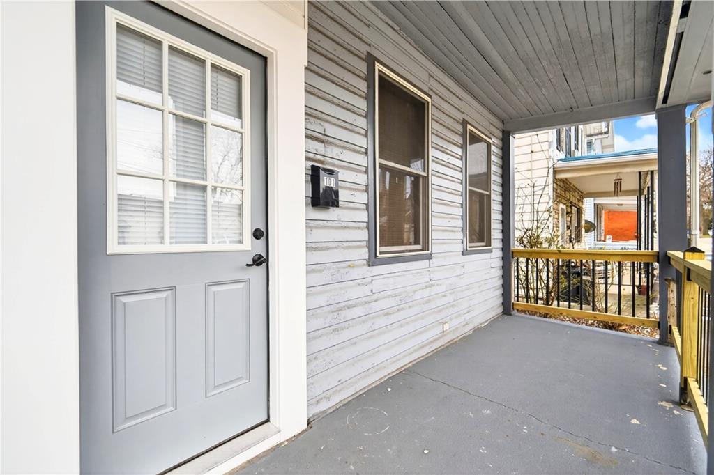 101 7th Street Monongahela, PA 15063 - Photo 2 of 43 a view of a porch with a door and wooden floor