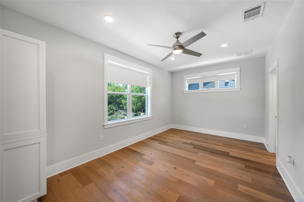 2821 Castro Street, Unit 1 Austin, TX 78702 - Photo 13 of 21 Spacious room featuring wood-finish flooring, recessed lighting, and a modern ceiling fan
