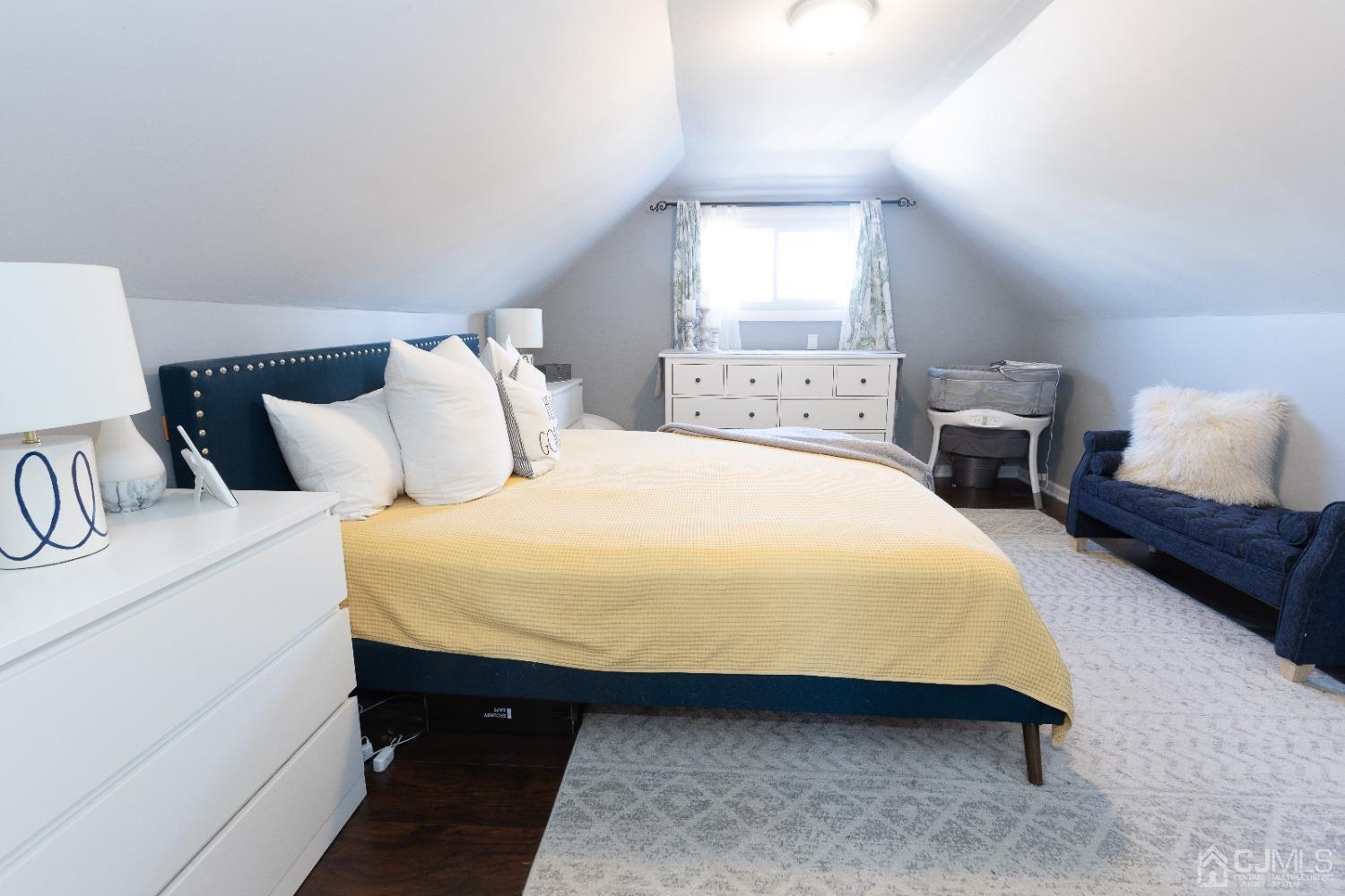 125 Tunison Road New Brunswick, NJ 08901 - Photo 17 of 24 a bedroom with a bed and window