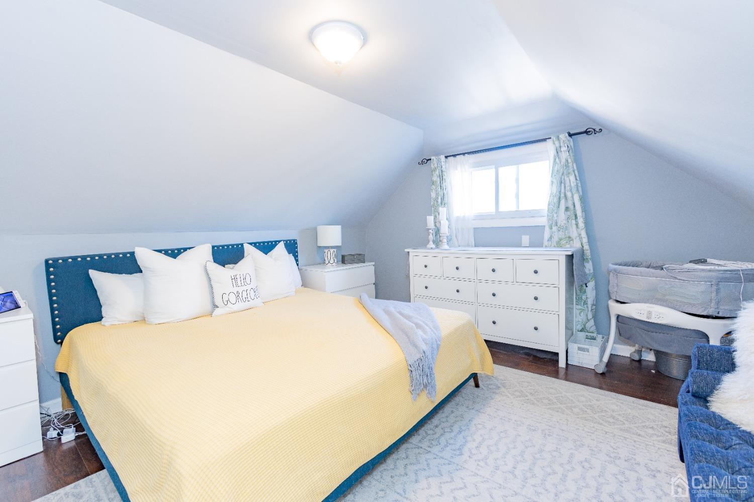 125 Tunison Road New Brunswick, NJ 08901 - Photo 19 of 24 a bedroom with a bed and a dresser