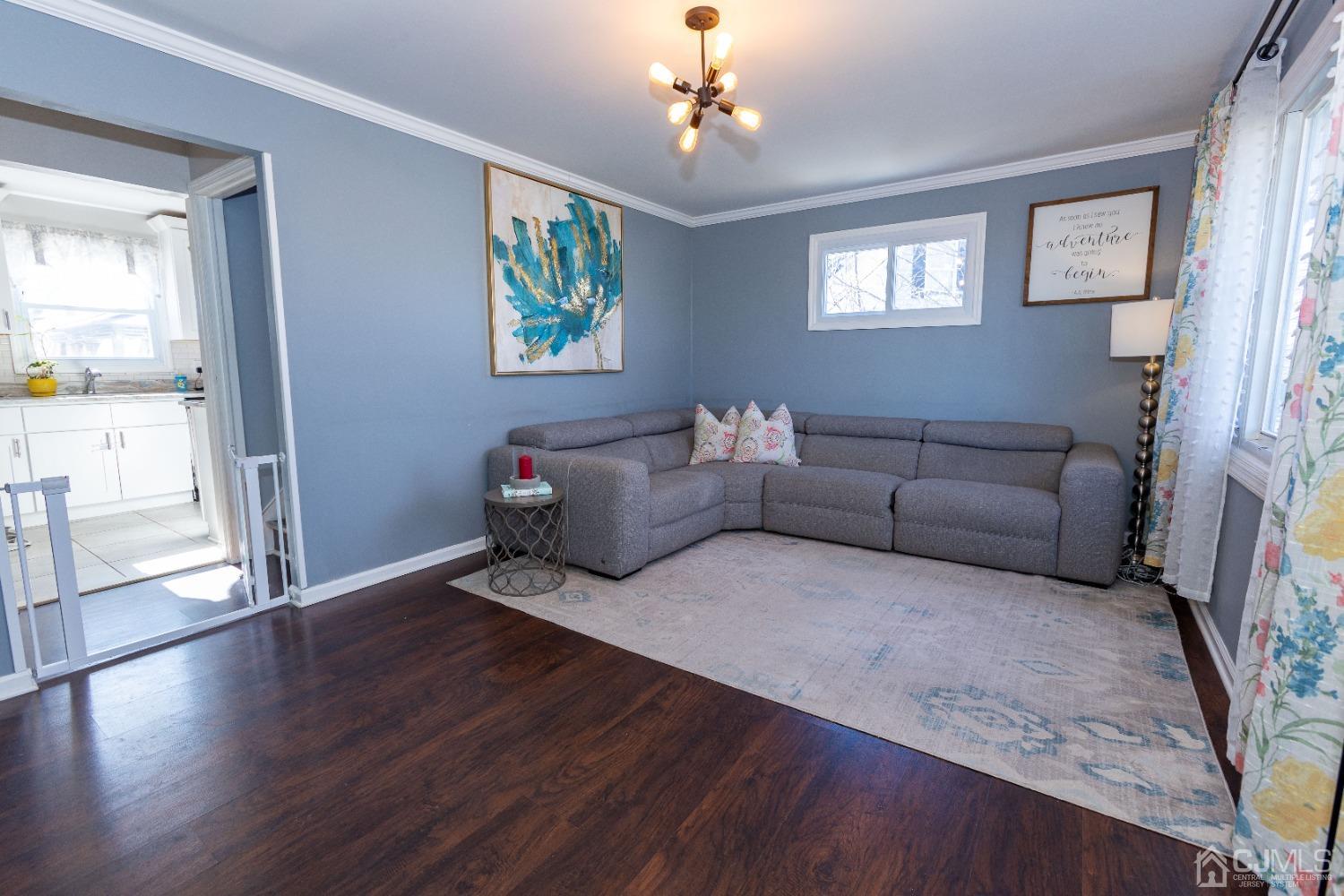 125 Tunison Road New Brunswick, NJ 08901 - Photo 2 of 24 a living room with furniture and a chandelier