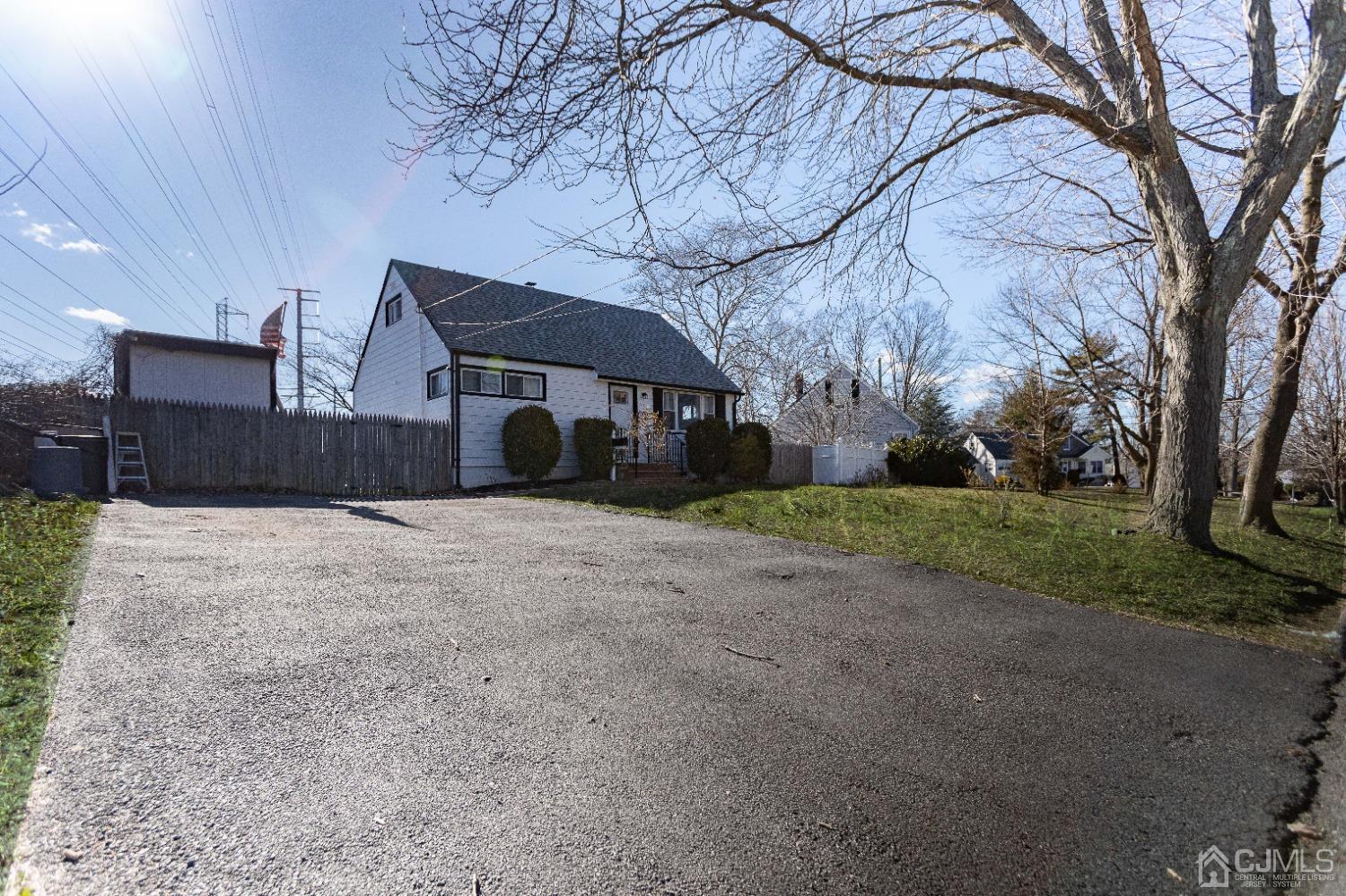 125 Tunison Road New Brunswick, NJ 08901 - Photo 23 of 24 a house that has a tree in front of it