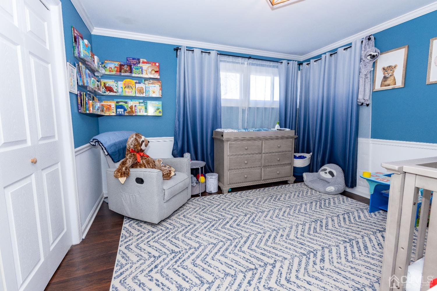 125 Tunison Road New Brunswick, NJ 08901 - Photo 6 of 24 a bedroom with furniture and a baby crib