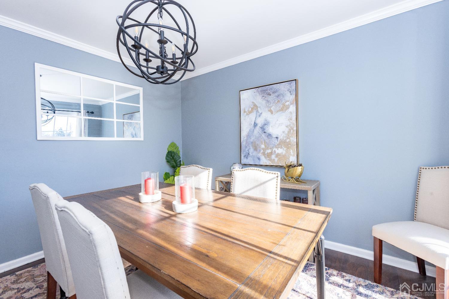 125 Tunison Road New Brunswick, NJ 08901 - Photo 8 of 24 a view of a dining room with furniture and a chandelier