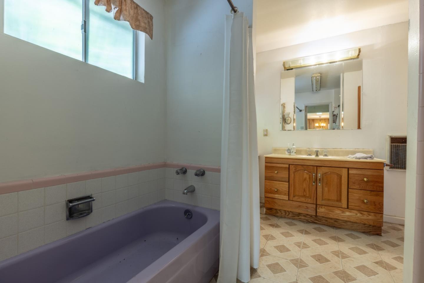 14233 Long Ridge Road Los Gatos, CA 95033 - Photo 4 of 14 a bathroom with a sink and a mirror