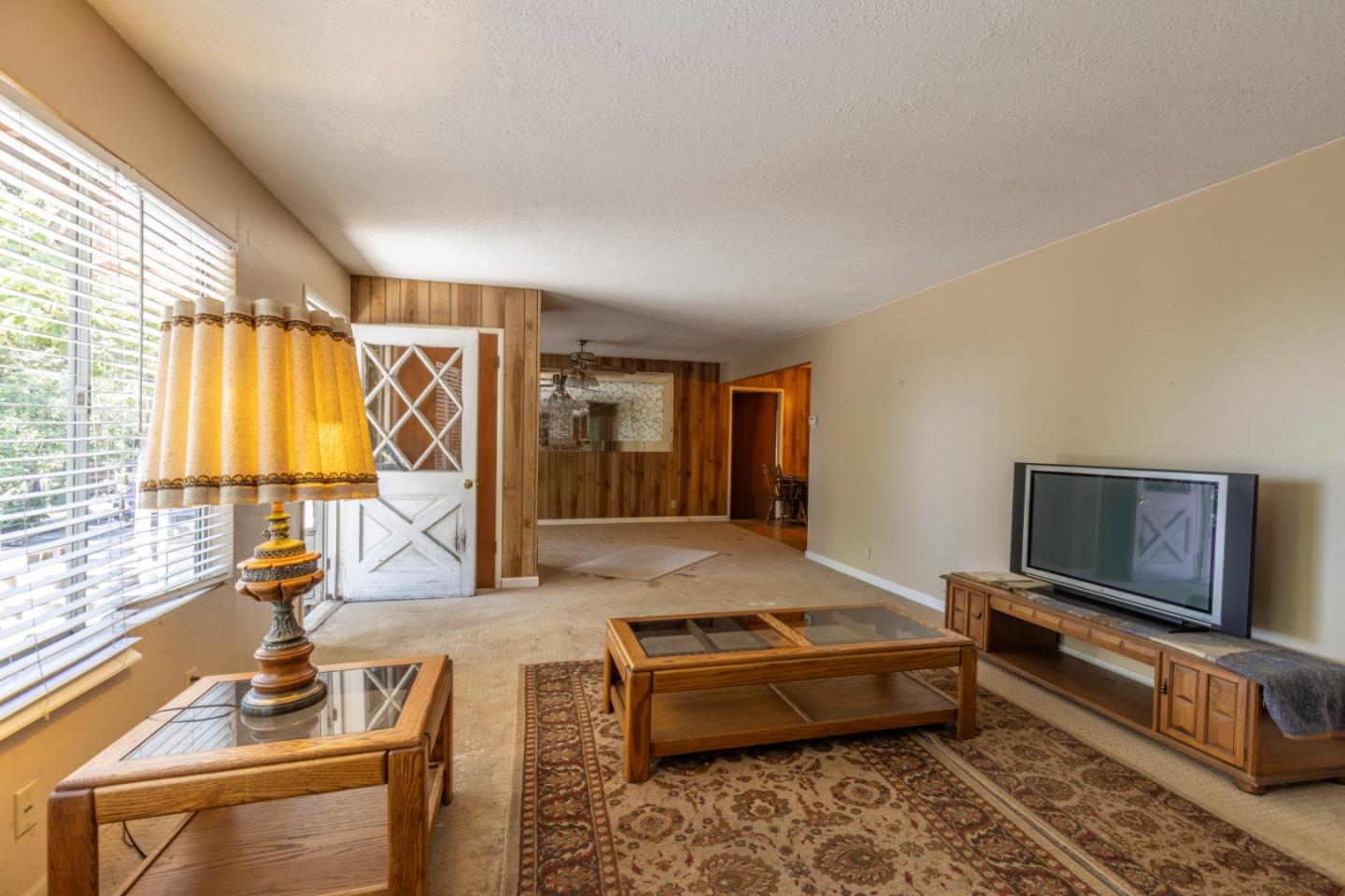 14233 Long Ridge Road Los Gatos, CA 95033 - Photo 7 of 14 a living room with furniture and a flat screen tv