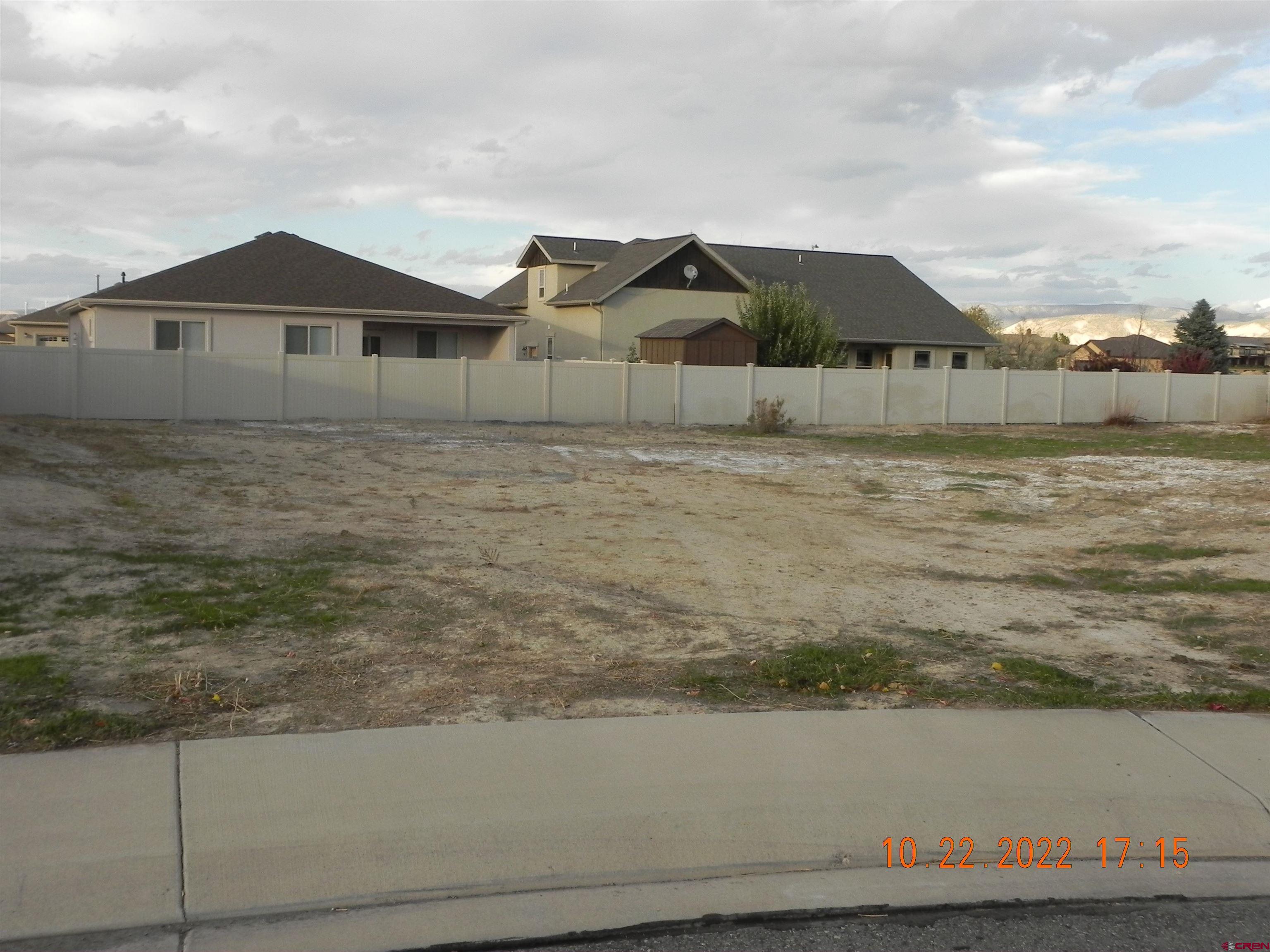 Lot 20 Glacier Court Montrose, CO 81401 - Photo 2 of 4 a front view of a house with a yard