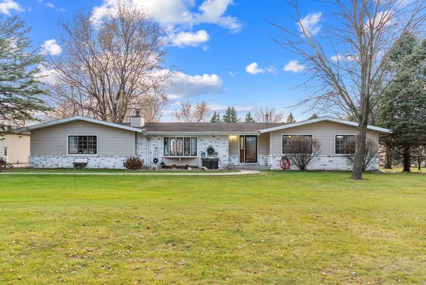 a front view of a house with swimming pool having outdoor seating