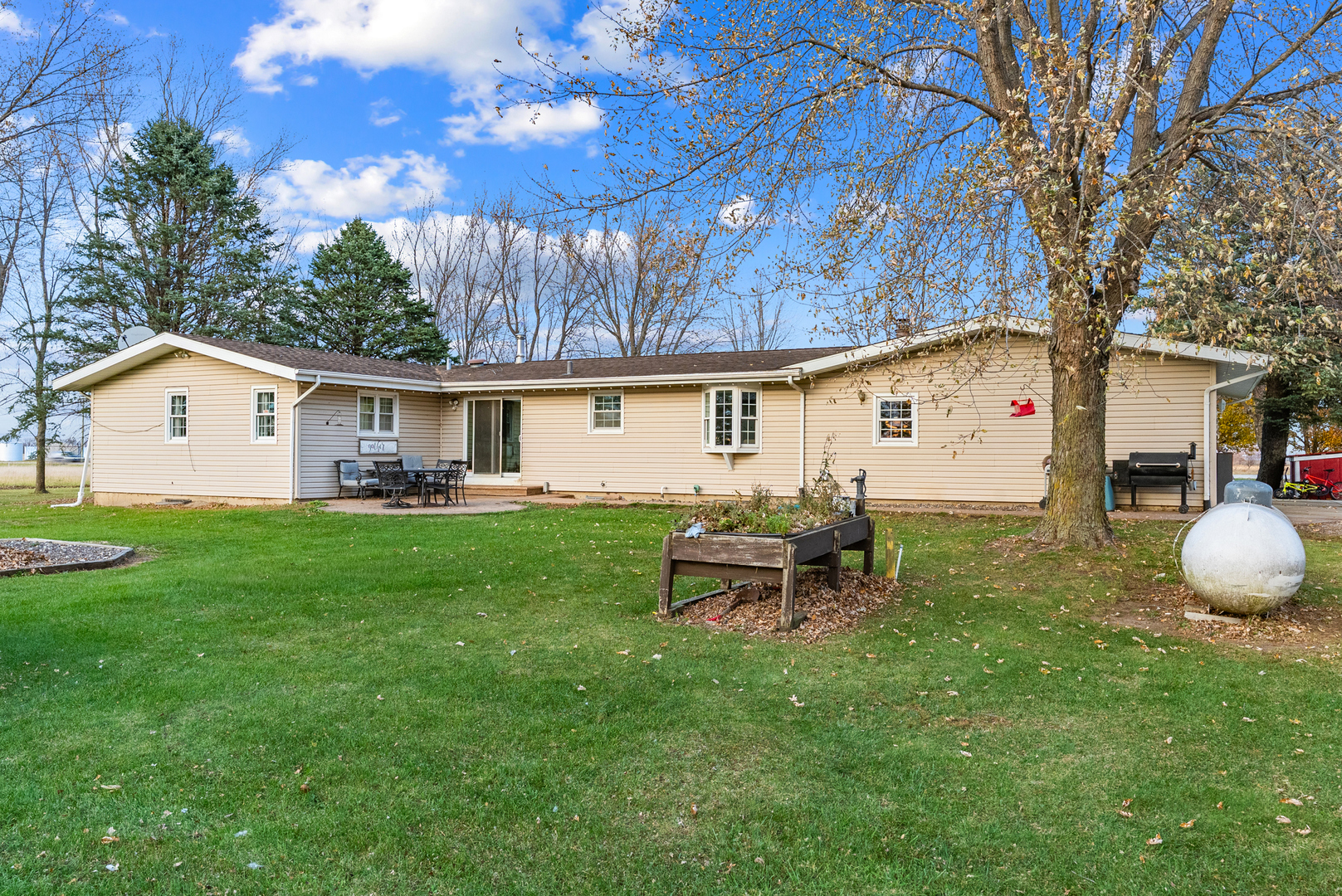 27440 Highway 52 Manhattan, IL 60442 - Photo 20 of 50 a view of a house with a backyard and sitting area