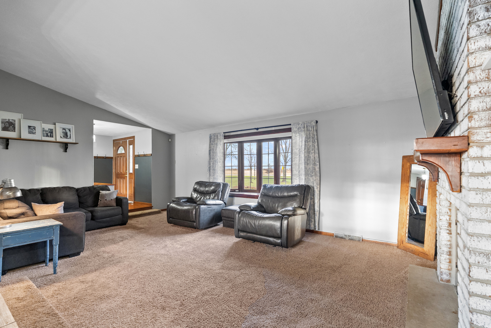 27440 Highway 52 Manhattan, IL 60442 - Photo 27 of 50 a living room with furniture and a fireplace