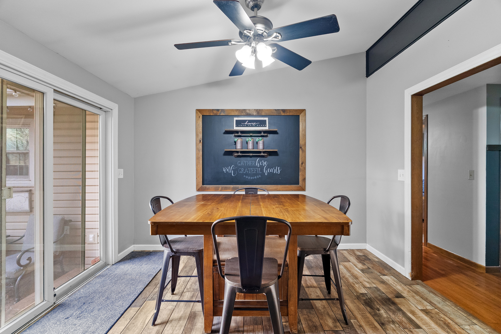 27440 Highway 52 Manhattan, IL 60442 - Photo 33 of 50 a view of a dining room with furniture and wooden floor