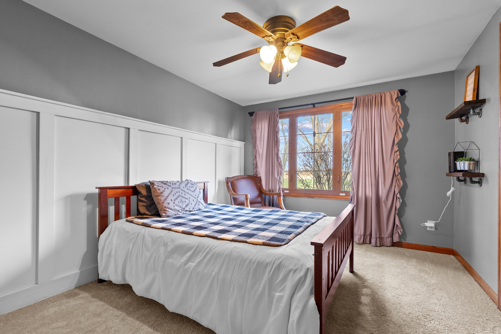 27440 Highway 52 Manhattan, IL 60442 - Photo 35 of 50 a bedroom with a large bed and a chandelier