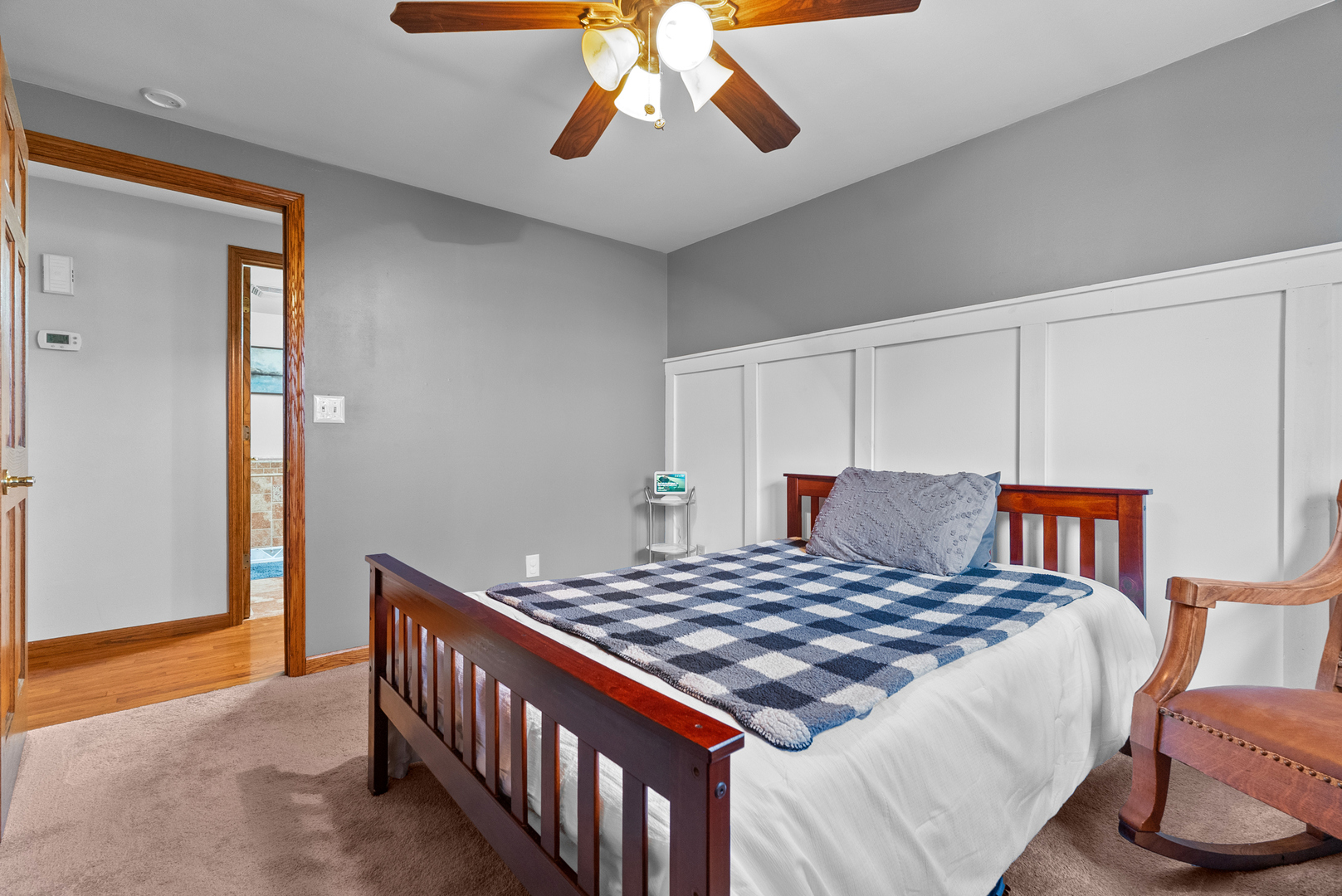 27440 Highway 52 Manhattan, IL 60442 - Photo 36 of 50 a bedroom with a bed and a lamp