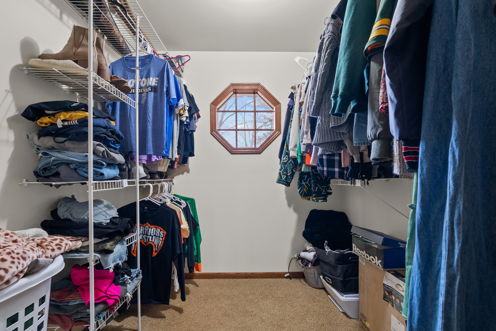 27440 Highway 52 Manhattan, IL 60442 - Photo 46 of 50 a view of walk in closet with clothes and shoes